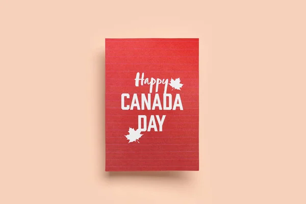 Card with text HAPPY CANADA DAY on beige background