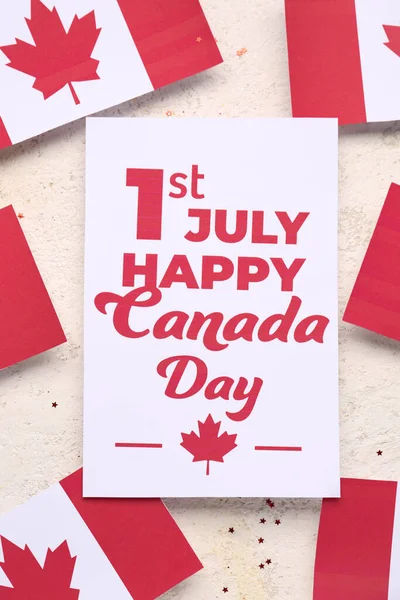 stock image Card with text 1ST JULY HAPPY CANADA DAY and flags on grunge background