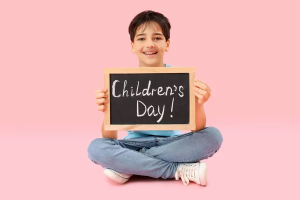 Little Boy Holding Chalkboard Text Children Day Pink Background — Stock Photo, Image