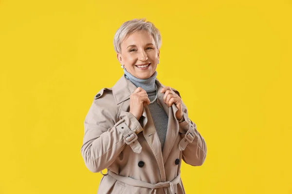 Beautiful Mature Woman Coat Yellow Background — Stock Photo, Image