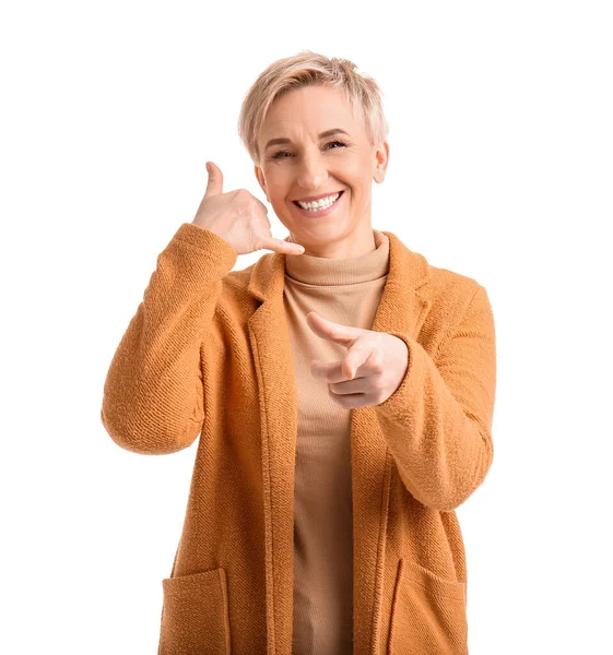 Cool Mature Woman Showing Call Gesture Pointing Viewer White Background — Stock Photo, Image