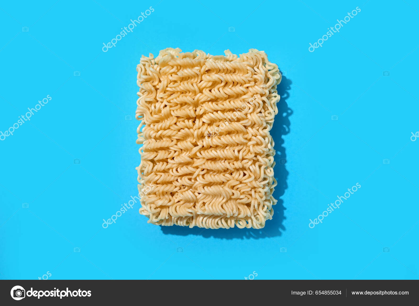 raw-instant-noodles-blue-background-stock-photo-serezniy-654855034