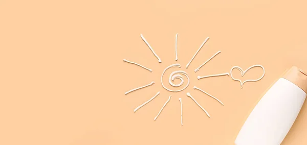 Bottle of sunscreen cream, drawn sun and heart on beige background