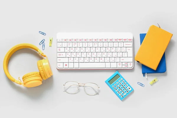 Composition Headphones Notebook Glasses Keyboard Calculator White Background — Stock Photo, Image