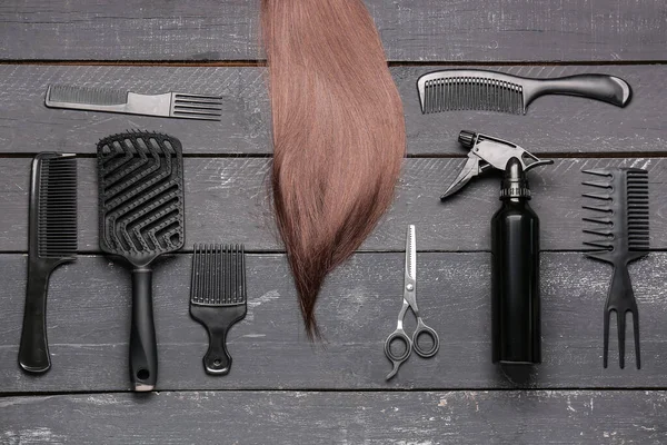 Brown Hair Brushes Scissors Spray Dark Wooden Background — Stock Photo, Image
