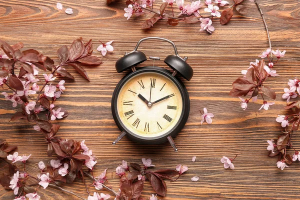 Beautiful Blossoming Branches Alarm Clock Wooden Background — Stock Photo, Image