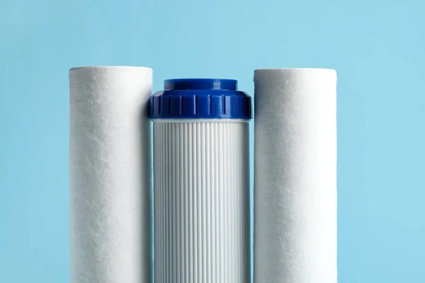 New Water Filter Cartridges Blue Background Closeup — Stock Photo, Image