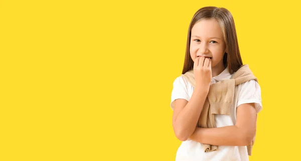 Little Girl Biting Nails Yellow Background Space Text — Stock Photo, Image