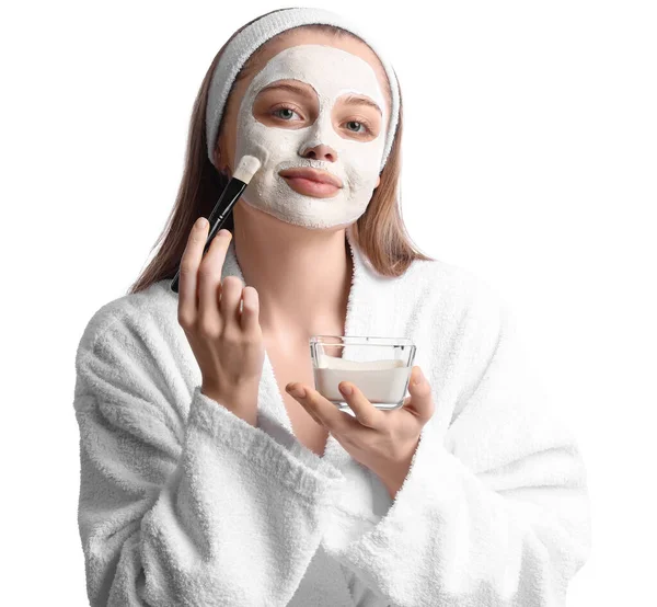 Young Woman Applying Turmeric Mask Brush White Background — Stok Foto