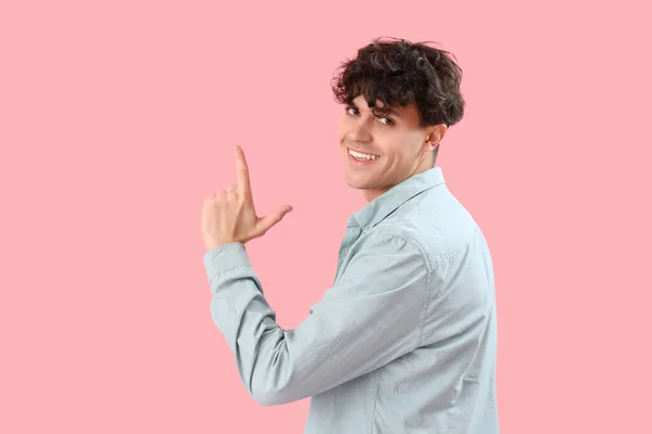 Young Man Showing Loser Gesture Pink Background — Stock Photo, Image