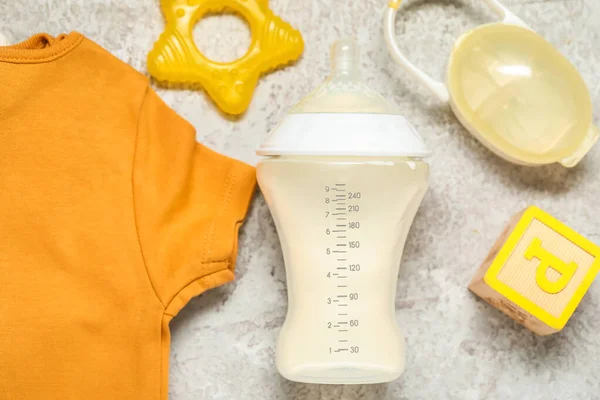 Bottle Milk Baby Bodysuits Accessories Grey Grunge Background — Stock Photo, Image