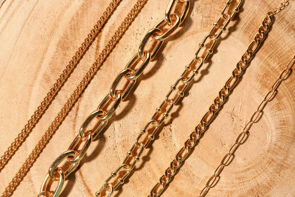 Beautiful Chain Bracelets Wooden Background — Stock Photo, Image