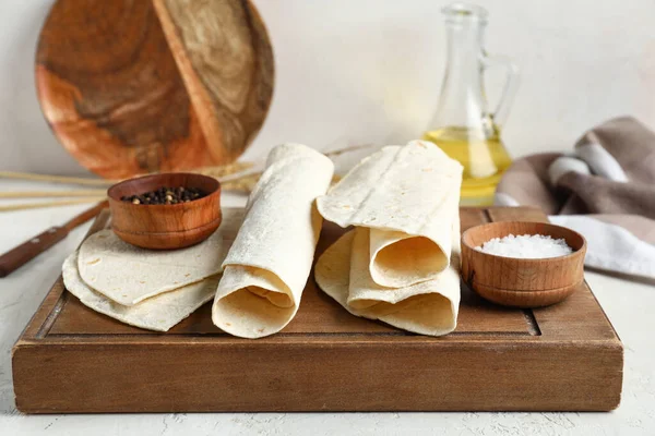 stock image Wooden board with fresh lavash on light background