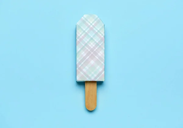 stock image Ice cream in package and stick on blue background