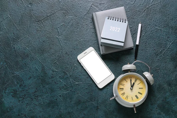 Flip Paper Calendar Alarm Clock Mobile Phone Notebook Dark Background — Stock Photo, Image