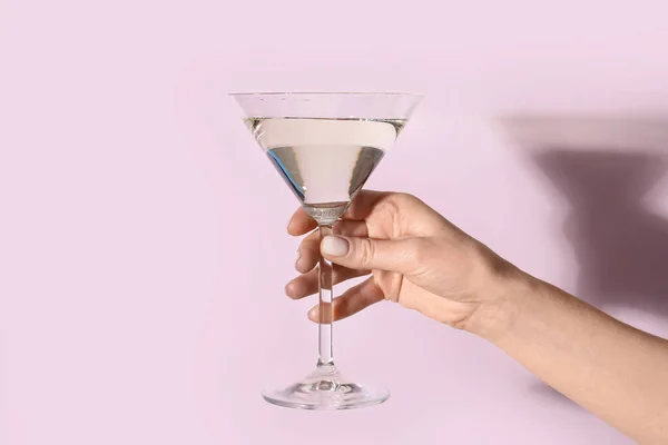 stock image Woman with glass of martini on lilac background