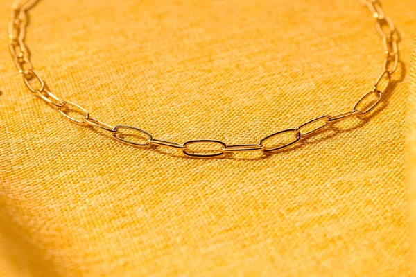 Beautiful Chain Necklace Yellow Fabric Background — Stock Photo, Image
