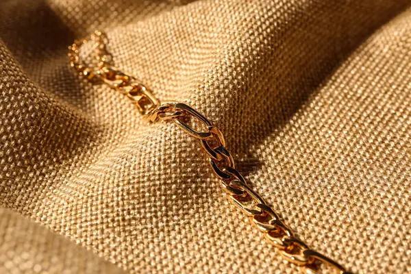 Beautiful Chain Bracelet Beige Fabric Background — Stock Photo, Image