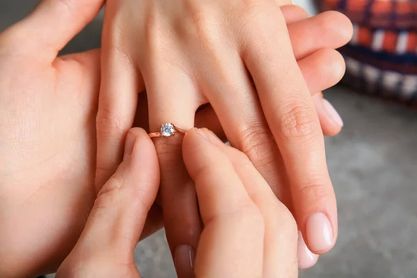 Man Putting Engagement Ring Woman Finger Grunge Background Closeup — Stock Photo, Image