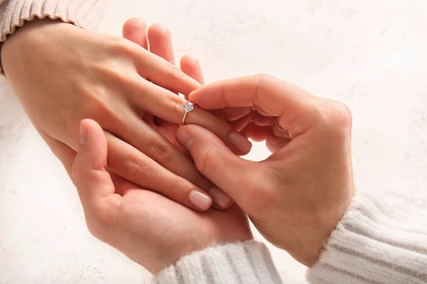 Man Putting Engagement Ring Woman Finger White Background Closeup — Stock Photo, Image
