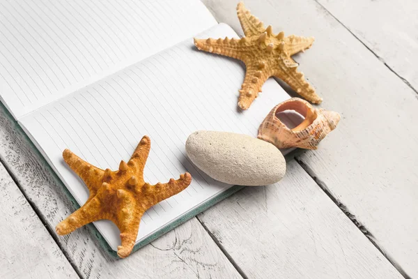 Open Notebook Starfishes Conch Stone White Wooden Background — Stock Photo, Image