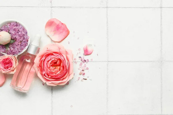 Bottle Cosmetic Oil Rose Extract Flowers White Tile Background — Stock Photo, Image