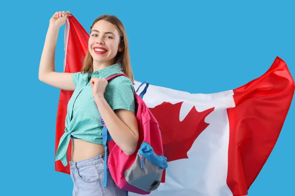Female student with flag of Canada on blue background