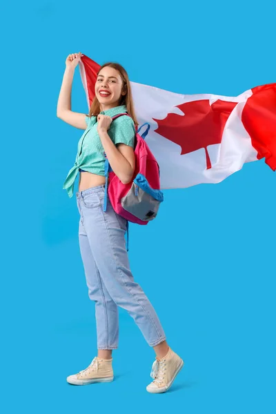 Female student with flag of Canada on blue background