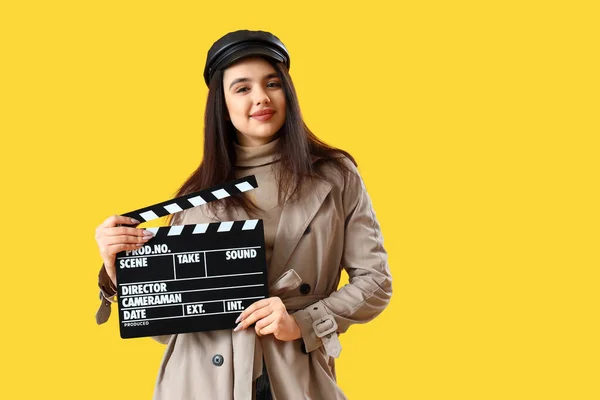 Female Film Director Movie Clapper Yellow Background — Stock Photo, Image