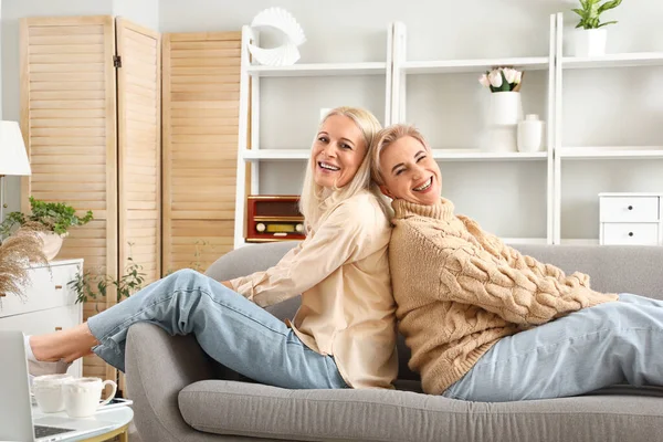 Happy Mature Women Sitting Sofa Home — Stock Photo, Image