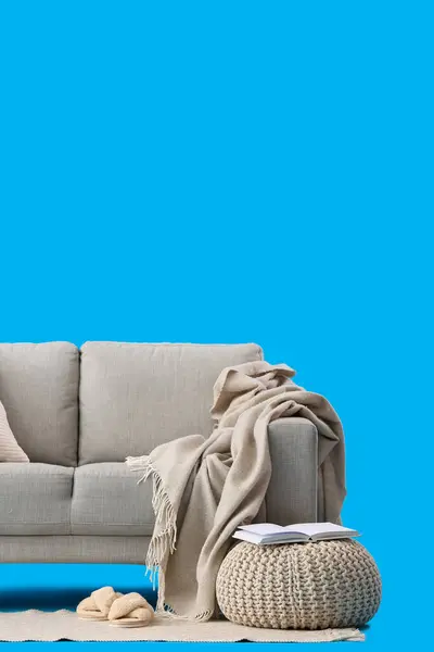 Cozy Grey Sofa Plaid Pouf Blue Background — Stock Photo, Image