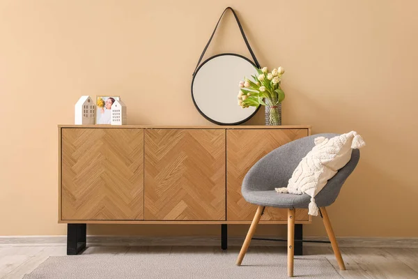 Armchair Wooden Cabinet Stylish Mirror Beige Wall — Stock Photo, Image