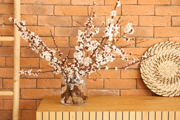 Vase Blooming Tree Branches Wooden Cabinet Brown Brick Wall — Stock Photo, Image