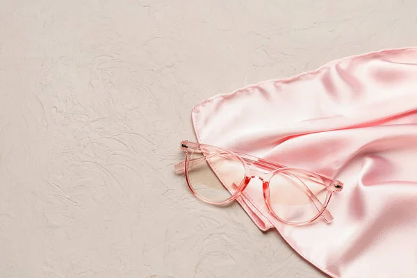Pink Eyeglasses Silk Fabric Grunge Background Closeup — Stock Photo, Image