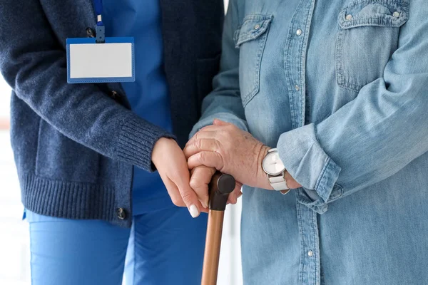 Young Caregiver Helping Senior Woman Walking Stick Kitchen Closeup — Stock Photo, Image