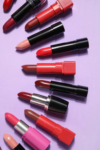 Different Lipsticks Lilac Background — Stock Photo, Image