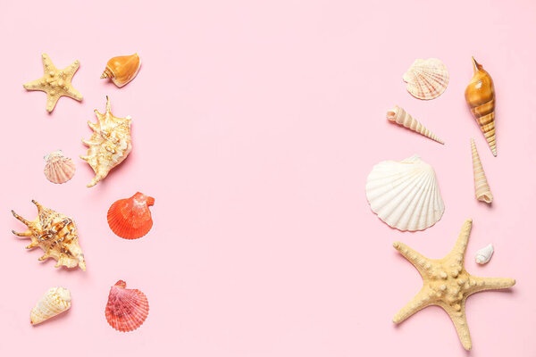 Frame made of seashells and starfishes on pink background