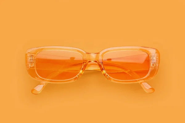 Nowoczesne Okulary Przeciwsłoneczne Pomarańczowym Tle — Zdjęcie stockowe