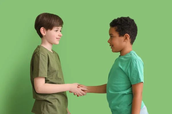 Little Boys Shaking Hands Green Background Children Day Celebration — Stock Photo, Image