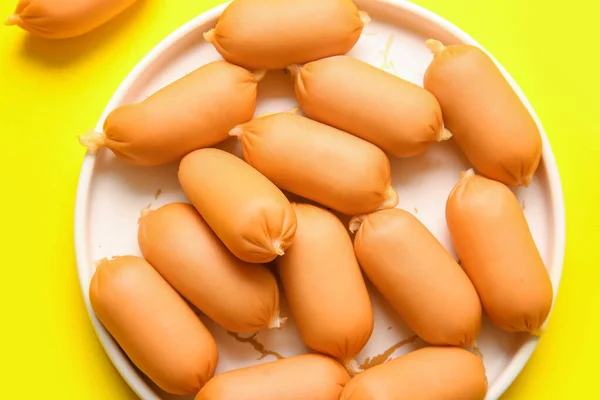 Plate Tasty Boiled Sausages Yellow Background — Stock Photo, Image