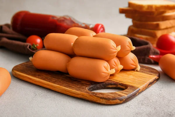 Board Tasty Boiled Sausages Grey Background — Stock Photo, Image