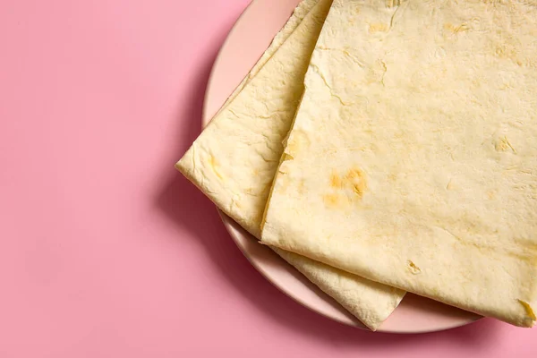 stock image Plate with fresh thin lavash on pink background