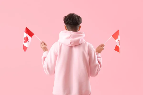Young Man Flags Canada Pink Background Back View — Stock Photo, Image