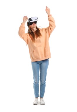 Pretty young woman in VR glasses isolated on white background