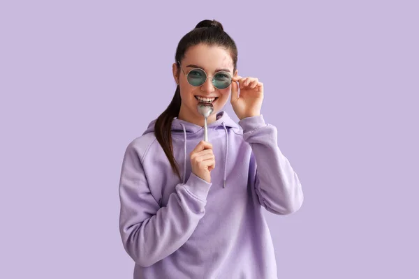Young Woman Silver Spoon Lilac Background — Stock Photo, Image