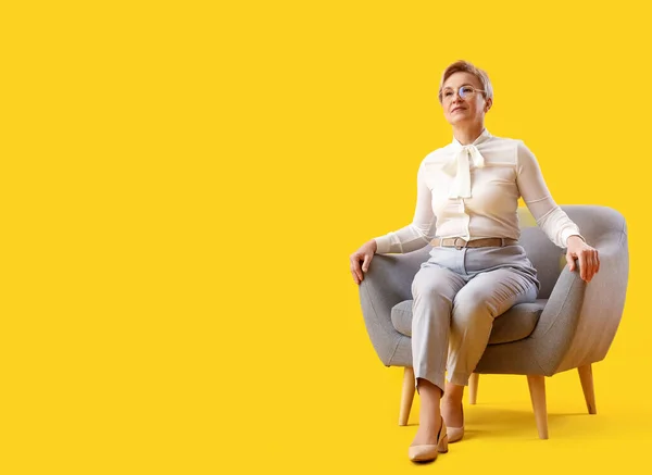 Mature Psychologist Sitting Armchair Yellow Background — Stock Photo, Image