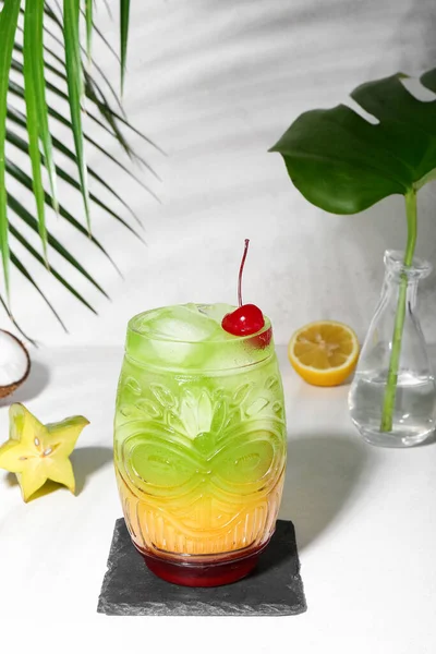 stock image Fresh summer cocktail with cherry on white table