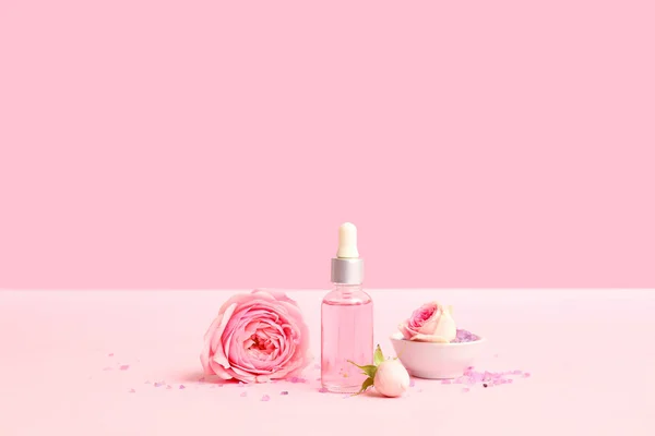 Bottle Cosmetic Oil Rose Extract Flowers Pink Background — Stock Photo, Image