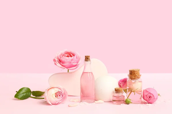 Bottles Cosmetic Oil Rose Extract Flowers Pink Background — Stock Photo, Image