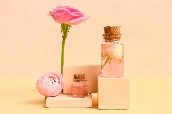 Bottles Cosmetic Oil Rose Extract Flowers Beige Background — Stock Photo, Image